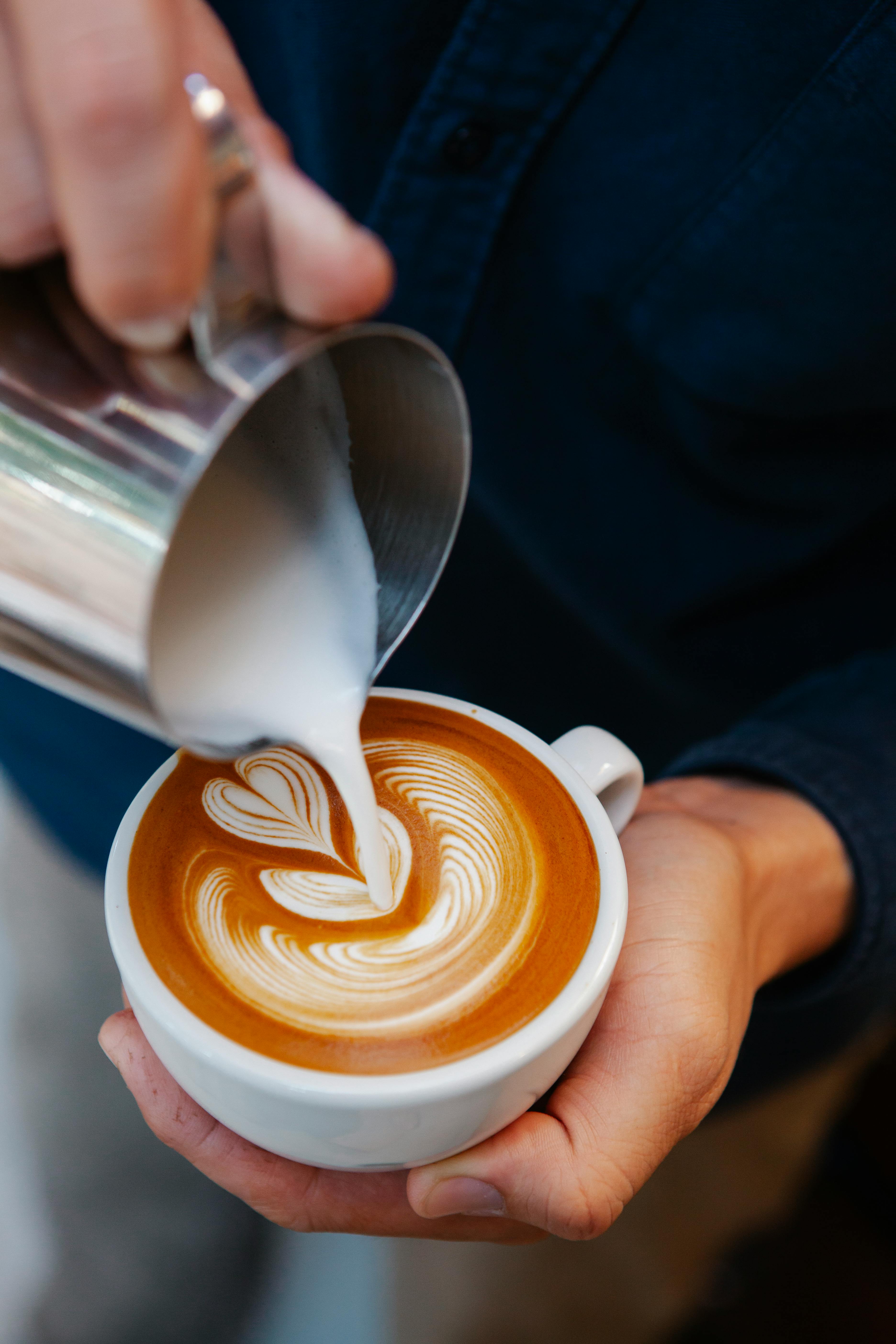 Beautiful latte art poured into a ceramic cup